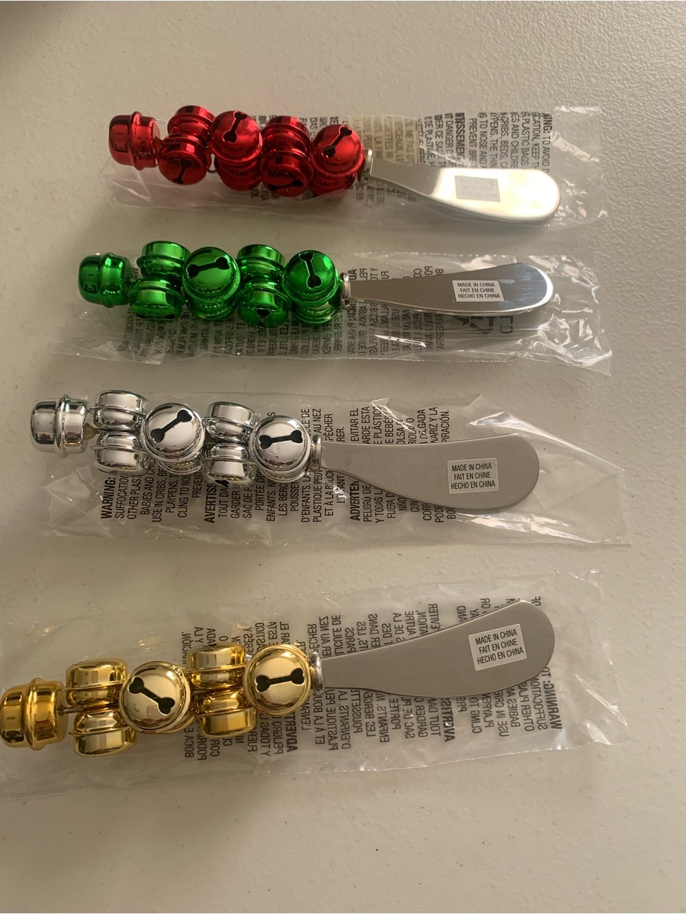 Jingle Bell Spreader Set of 4 Multicolor Brand New Avon 2011